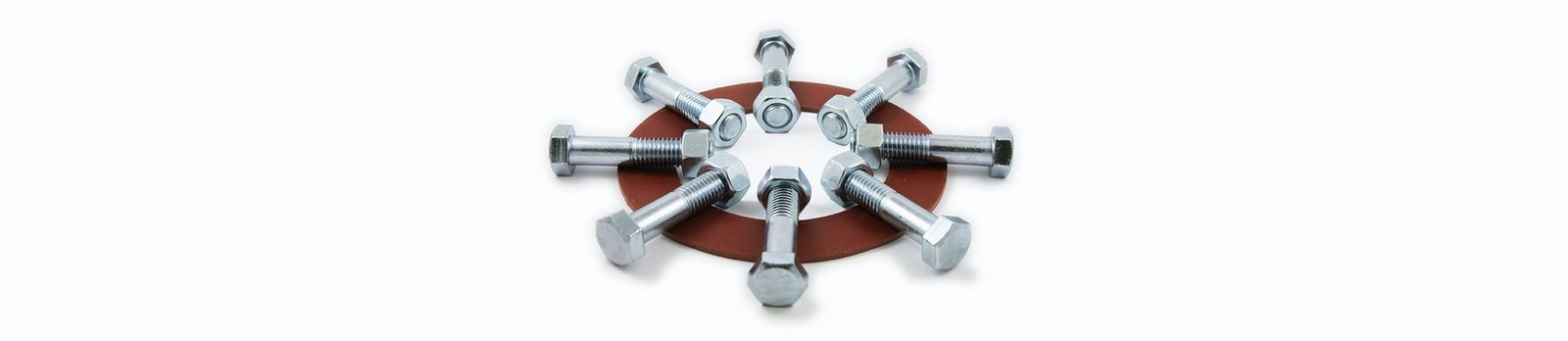 Machine bolts and heavy hex nuts arranged around a rubber flange gasket