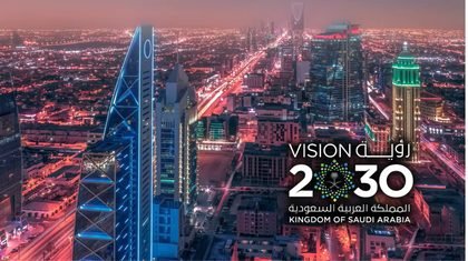 Riyadh at night under the Saudi Vision 2030 mark
